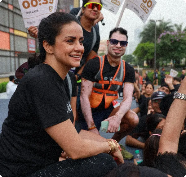 Indian celebrity with a group of people at a sports event.